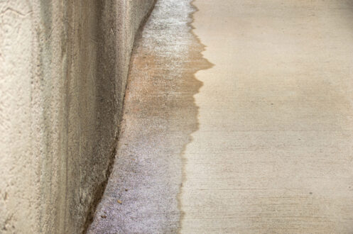 Entrance to a parking lot with entrance of outside water caused by heavy rains